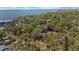 Scenic aerial view showcasing the property amidst lush trees and waterfront backdrop at 3025 50Th St S S St, Gulfport, FL 33707
