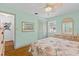 Comfortable bedroom featuring a full bed, hardwood floors, neutral paint, and a closet at 3025 50Th St S S St, Gulfport, FL 33707