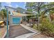 Cozy carport, a shaded gazebo, and lush landscaping in the backyard, offering a delightful outdoor retreat at 3025 50Th St S S St, Gulfport, FL 33707