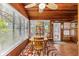 Dining area featuring a wood ceiling, windows with blinds and a ceiling fan at 3025 50Th St S S St, Gulfport, FL 33707
