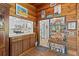Charming dining area with wood paneling and an adjacent kitchen at 3025 50Th St S S St, Gulfport, FL 33707