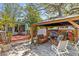 Outdoor living space with a gazebo featuring comfortable seating and decor for relaxing, and a deck for dining at 3025 50Th St S S St, Gulfport, FL 33707