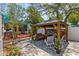 Inviting gazebo with a comfortable seating area, an adjacent deck, and lush landscaping to create a tranquil outdoor at 3025 50Th St S S St, Gulfport, FL 33707