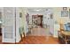 Bright hallway with hardwood and tile flooring, connecting living areas and providing smooth transitions at 3025 50Th St S S St, Gulfport, FL 33707