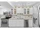 Modern kitchen with stainless steel appliances, white cabinets, and ample counter space at 3025 50Th St S S St, Gulfport, FL 33707