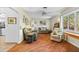 Bright living room with tile floors, comfortable seating, and natural light from the large window at 3025 50Th St S S St, Gulfport, FL 33707