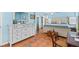 Bright main bedroom featuring tile floors, blue walls, white trim and a full size bed at 3025 50Th St S S St, Gulfport, FL 33707
