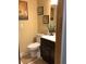 Bathroom featuring a toilet, vanity with dark wood cabinets, and neutral wall paint at 31258 Park Ridge Dr, Brooksville, FL 34602