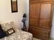 Cozy bedroom features a patterned daybed and a large wooden armoire at 31258 Park Ridge Dr, Brooksville, FL 34602