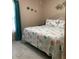 Bright bedroom featuring a coastal-themed bedspread and matching pillows at 31258 Park Ridge Dr, Brooksville, FL 34602