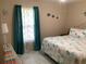 Bedroom featuring colorful curtains and decor plus a bed with an ocean theme at 31258 Park Ridge Dr, Brooksville, FL 34602