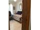 Small bedroom with a daybed, tile floor, and neutral decor at 31258 Park Ridge Dr, Brooksville, FL 34602