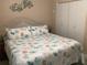 Bedroom featuring a bed with nautical decor, a window, and built-in closets at 31258 Park Ridge Dr, Brooksville, FL 34602