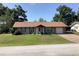 Charming single-story home with stone accents, attached garage, manicured lawn, and inviting curb appeal at 31258 Park Ridge Dr, Brooksville, FL 34602