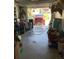 Spacious garage interior with a red truck visible in the driveway at 31258 Park Ridge Dr, Brooksville, FL 34602