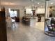 Open-concept living space showcasing a kitchen with bar seating and modern appliances at 31258 Park Ridge Dr, Brooksville, FL 34602