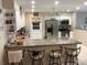 Well-lit kitchen features granite counters, stainless appliances, and bar seating at 31258 Park Ridge Dr, Brooksville, FL 34602