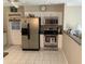 Modern kitchen with stainless steel appliances, white cabinets, and ample counter space at 31258 Park Ridge Dr, Brooksville, FL 34602