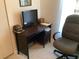 A functional home office space with a simple desk and comfortable chair at 31258 Park Ridge Dr, Brooksville, FL 34602