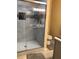 Updated shower features glass doors, tiled walls and flooring, and overhead lighting at 31258 Park Ridge Dr, Brooksville, FL 34602
