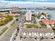 Stunning aerial view of townhouses showcasing beautiful waterfront views and city skyline at 320 Island Way # 202, Clearwater Beach, FL 33767