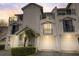 Charming townhouse featuring multiple balconies, attached garages, and well-maintained landscaping at 320 Island Way # 202, Clearwater Beach, FL 33767
