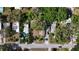 Aerial view of home featuring lush surroundings, a large backyard, driveway, and ample parking at 38327 Palm Grove Dr, Zephyrhills, FL 33542