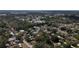 An aerial view showcases the neighborhood's layout and lush greenery at 38327 Palm Grove Dr, Zephyrhills, FL 33542