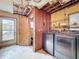 Laundry room features modern machines and wire shelving at 38327 Palm Grove Dr, Zephyrhills, FL 33542