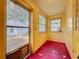 Sunroom features painted walls and windows offering natural light at 38327 Palm Grove Dr, Zephyrhills, FL 33542