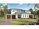 Beautiful two-story home with a three-car garage, manicured lawn, and inviting curb appeal at 3914 W San Rafael St, Tampa, FL 33629