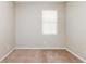 A cozy bedroom with neutral walls, carpet flooring, and a window with blinds at 416 Durham Shore Ct, Apollo Beach, FL 33572