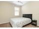 Carpeted bedroom with a ceiling fan, and large bed next to a bedside table at 416 Durham Shore Ct, Apollo Beach, FL 33572