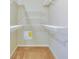 Walk-in closet with carpet flooring and white-painted, adjustable shelving units at 416 Durham Shore Ct, Apollo Beach, FL 33572