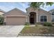 Charming single-Gathering home with a well-manicured lawn and two-car garage at 416 Durham Shore Ct, Apollo Beach, FL 33572