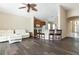 Open-concept living room offering kitchen views and access to a screened-in porch at 416 Durham Shore Ct, Apollo Beach, FL 33572