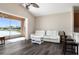 Open living room offers a water view, modern furniture, and an airy atmosphere with seamless indoor-outdoor flow at 416 Durham Shore Ct, Apollo Beach, FL 33572
