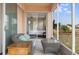 Relaxing screened patio overlooking the lake, with comfortable seating and convenient access to the bedroom at 416 Durham Shore Ct, Apollo Beach, FL 33572