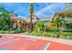 Attractive clubhouse exterior features lush landscaping, ample parking, and a welcoming facade at 4207 S Dale Mabry Hwy # 12206, Tampa, FL 33611
