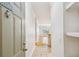 Bright hallway featuring tiled flooring and view into the living room with hardwood floors at 4207 S Dale Mabry Hwy # 12206, Tampa, FL 33611
