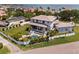 An aerial showcases a modern home's layout with pool, lawn, and proximity to the bay at 4300 Bayshore Ne Blvd, St Petersburg, FL 33703