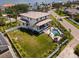 An elevated view of a modern home with a pool, patio, and large green lawn at 4300 Bayshore Ne Blvd, St Petersburg, FL 33703