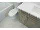 Modern bathroom with a sleek toilet, patterned tile, and elegant vanity at 4300 Bayshore Ne Blvd, St Petersburg, FL 33703
