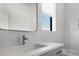 Close up on bright bathroom vanity with chrome faucet, window and textured tiles at 4300 Bayshore Ne Blvd, St Petersburg, FL 33703