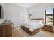 Serene bedroom featuring wood accents, large window, and neutral decor at 4300 Bayshore Ne Blvd, St Petersburg, FL 33703