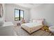 Bright bedroom with a large window, pastel decor, and plush accents at 4300 Bayshore Ne Blvd, St Petersburg, FL 33703