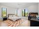 bedroom features an ample windows, patterned rug, and neutral walls, creating a playful ambiance at 4300 Bayshore Ne Blvd, St Petersburg, FL 33703