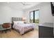 Comfortable bedroom with a contemporary design, large window, and hardwood floors at 4300 Bayshore Ne Blvd, St Petersburg, FL 33703