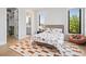 Cozy bedroom boasts an patterned rug, natural light, and neutral walls, creating a calm and inviting space at 4300 Bayshore Ne Blvd, St Petersburg, FL 33703
