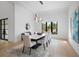 Modern dining room with stylish lighting, a sleek table, and elegant chairs at 4300 Bayshore Ne Blvd, St Petersburg, FL 33703